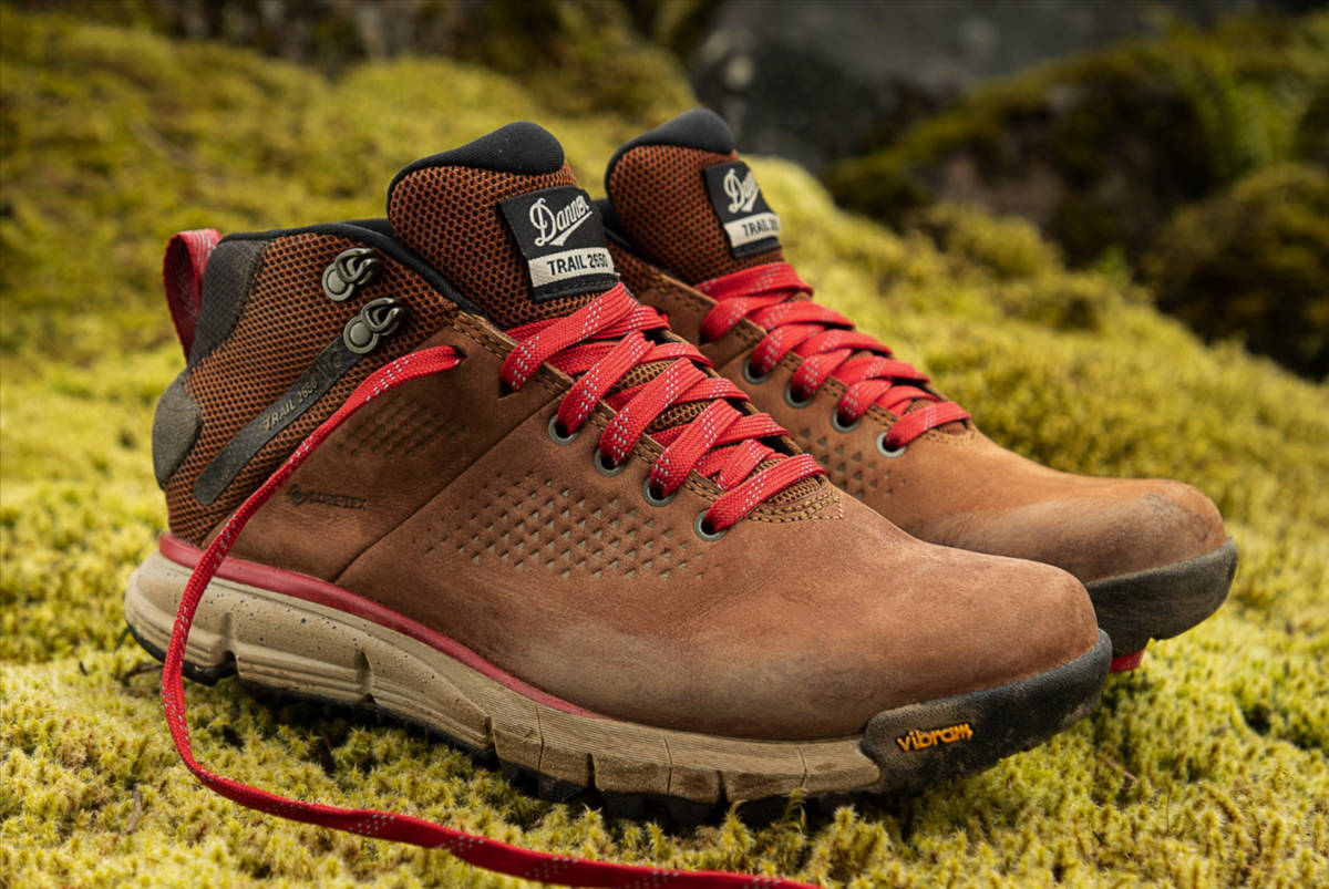 A pair of women's Danner Trail 2650 Mid Gore-Tex boots on a mossy rock