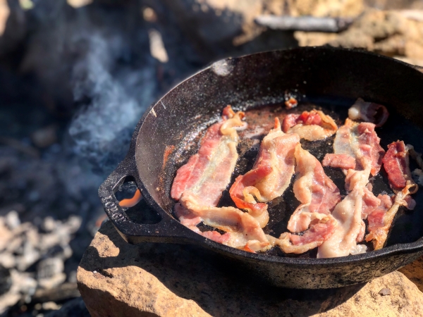 Cooking bacon while camping