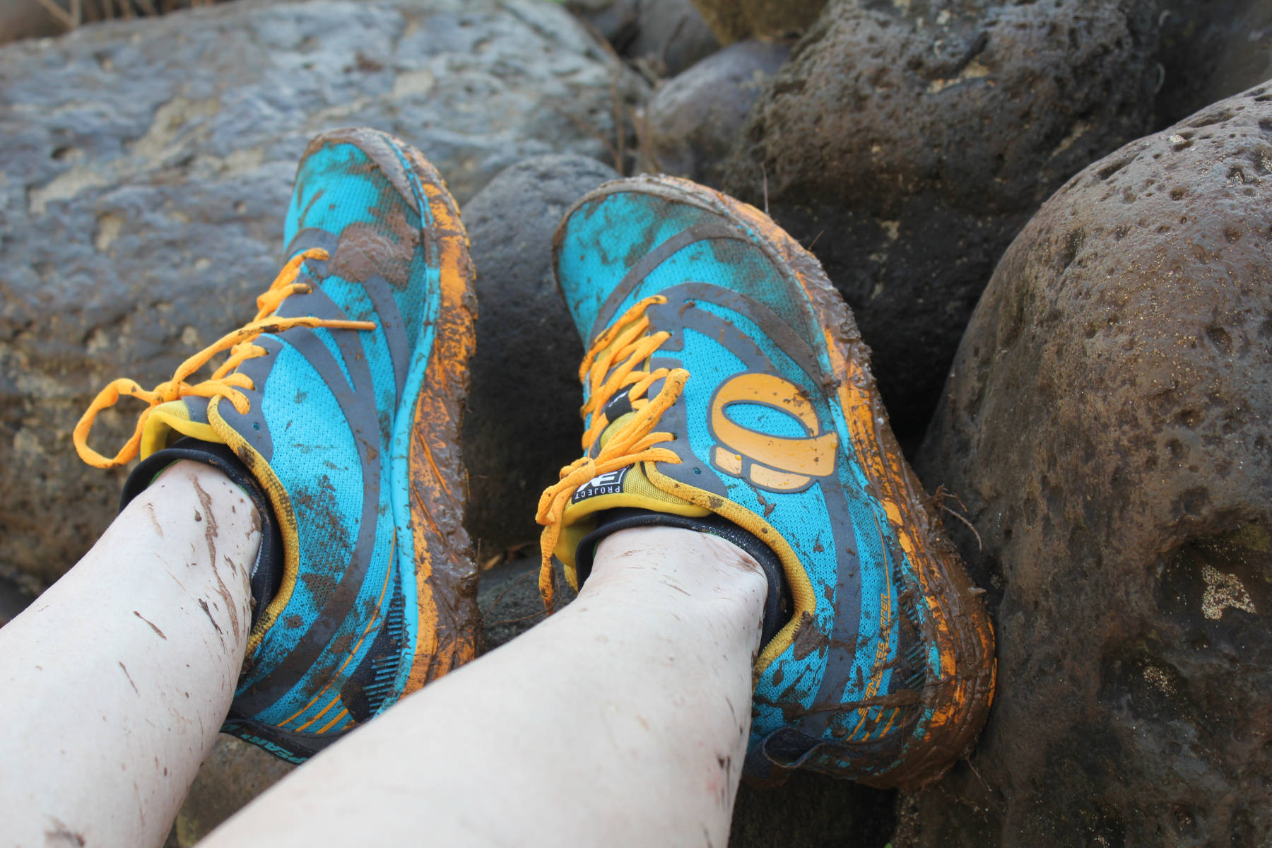 Muddy hiking shoes while on the Kalalau Trail in Hawaii - Hello Trail