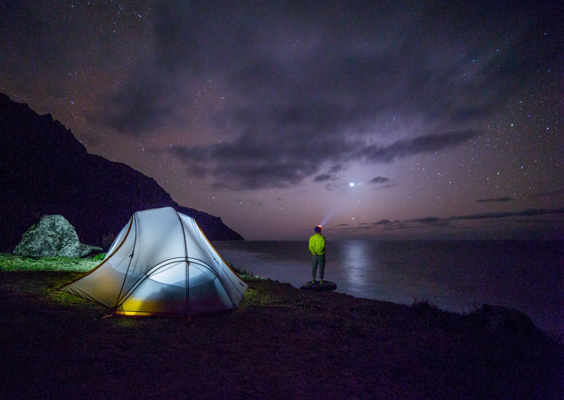 Choosing the right headlamp for hiking and camping is important. This camper is enjoying the night skies with his red light feature.
