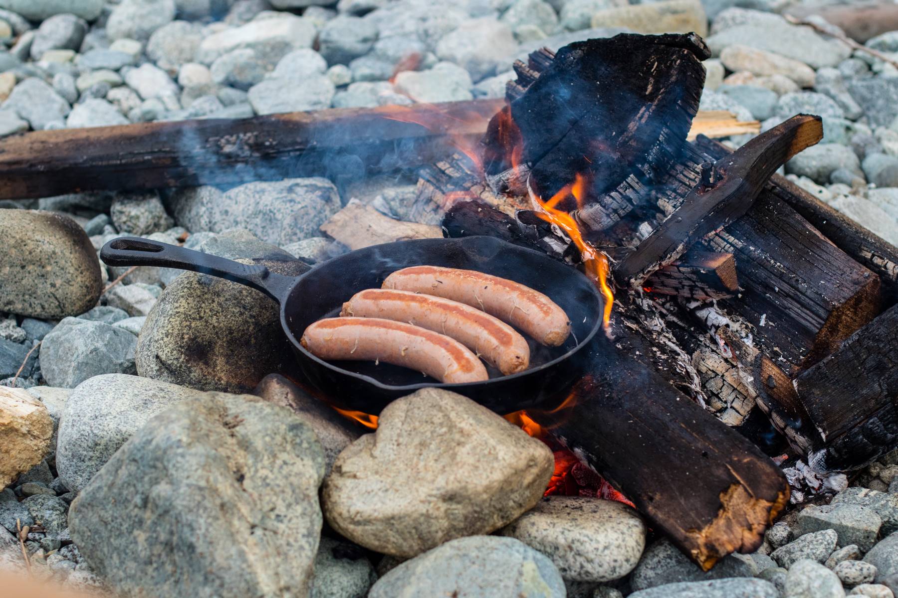 Cast iron skillet for cooking over open fire camping