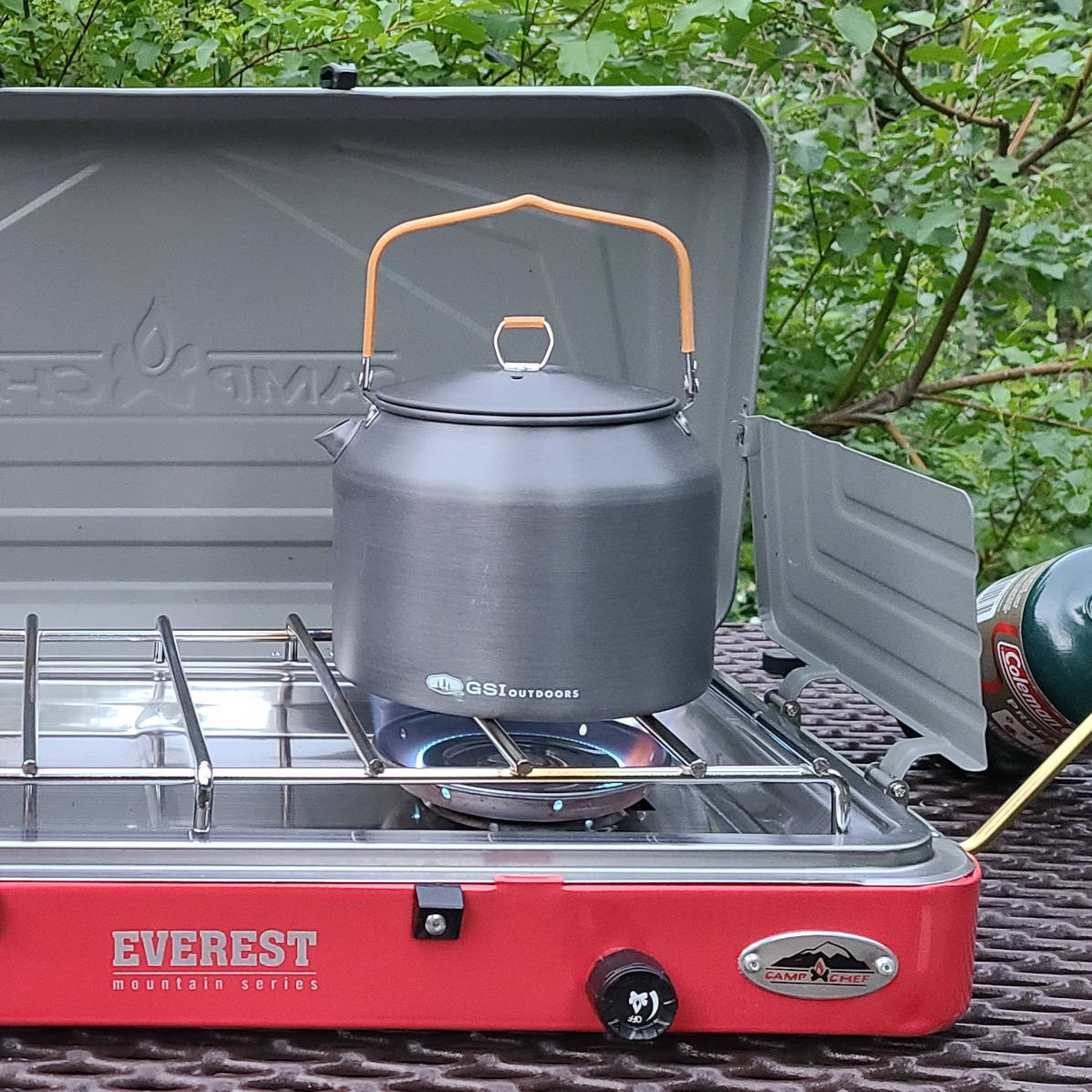 Kettle boiling water on a camp stove - HelloTrail