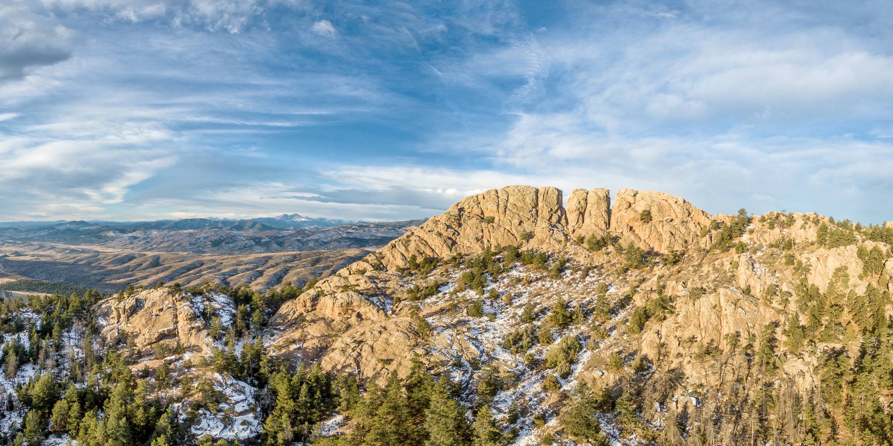 When deciding where to go hiking around Fort Collins, Horsetooth Mountain Loop is a must-do trail with rock formations, pine forests, and blue skies.