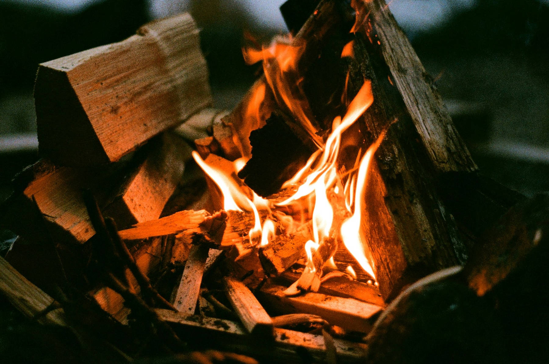 Starting a campfire at a campsite - HelloTrail.com