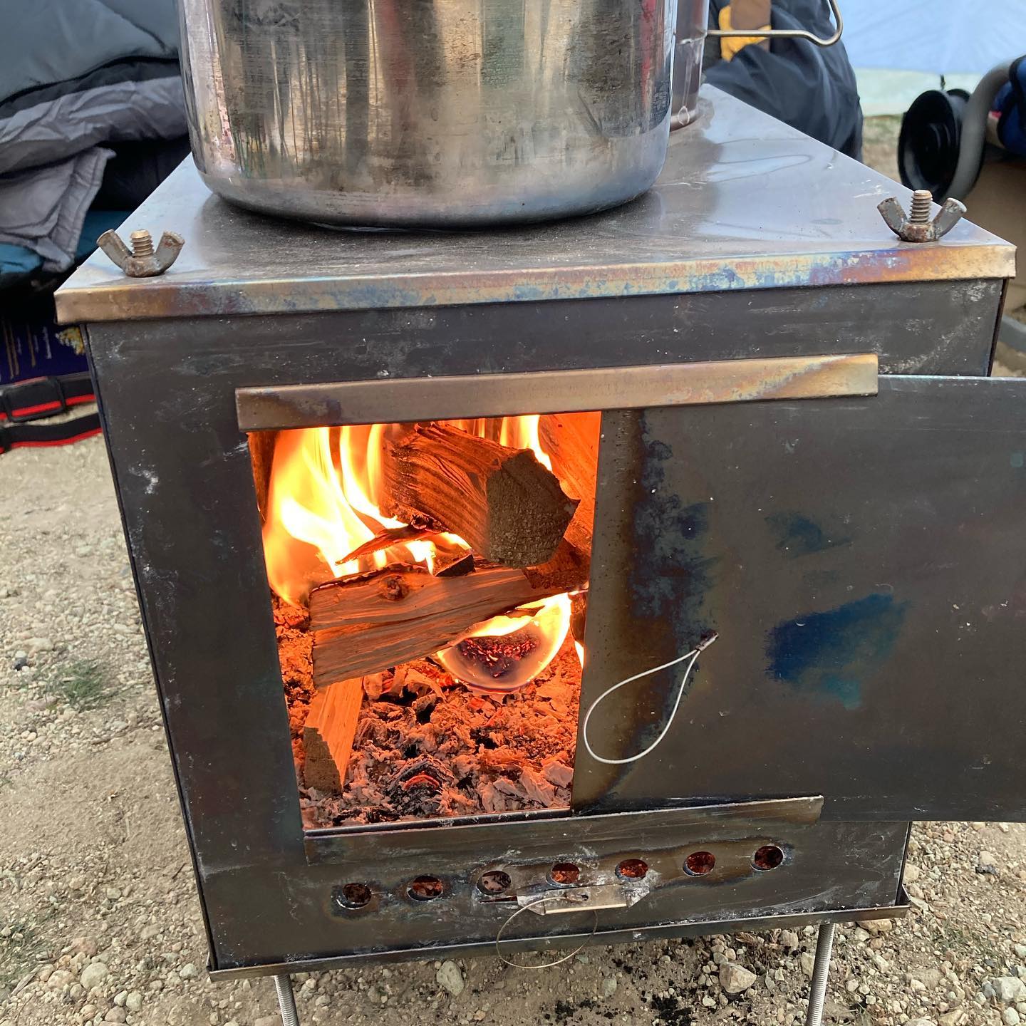 Portable camping stove with wood burning inside it - Hello Trail