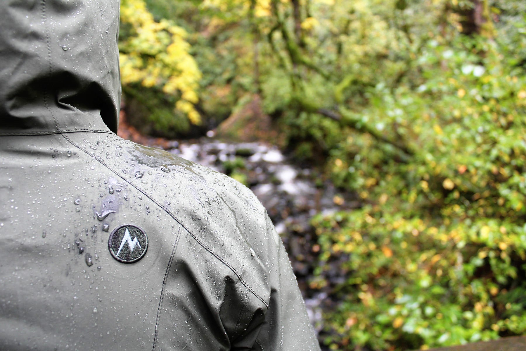 Ashley wearing her rain jacket hiking in Oregon's Columbia River Gorge - HelloTrail