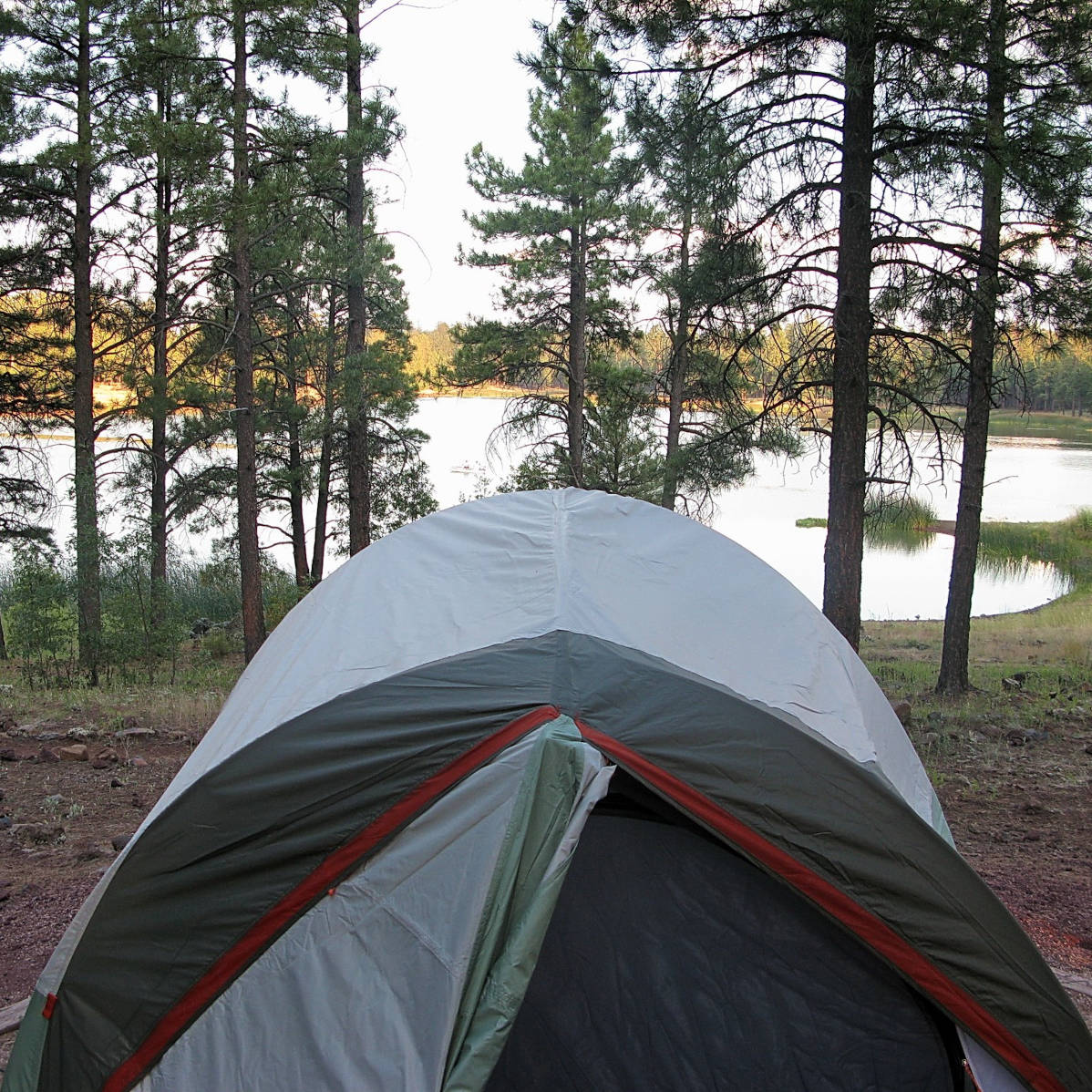 A six person camping tent looking out towards a lake - HelloTrail.com