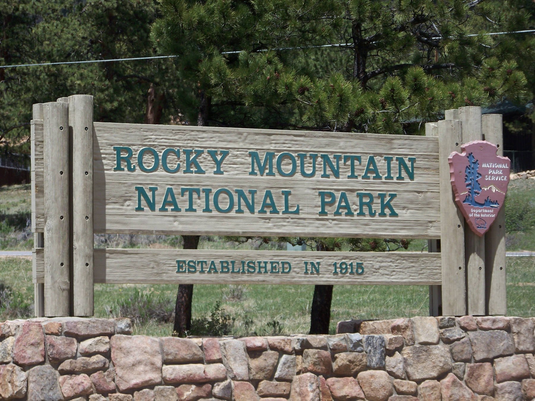Entrance sign to Rocky Mountain National Park a couple miles outside Estes Park Colorado